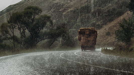 rain over truck on the road thumbnail