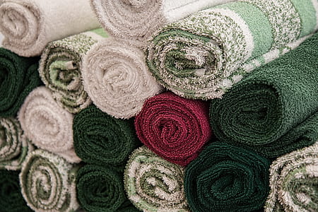 close-up photo of assorted-color rolled rug lot thumbnail
