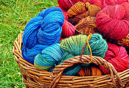assorted-colored yarns in basket thumbnail