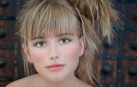 closeup photo of blonde haired woman's face thumbnail