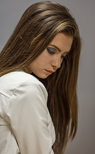 focus photo of woman in white shirt thumbnail