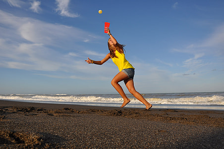 woman jumping on seashore thumbnail