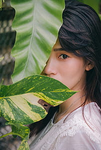 Closeup Photo of Woman Wearing White Crew-neck Top thumbnail