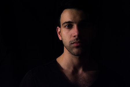 man wearing black scoop-neck shirt thumbnail