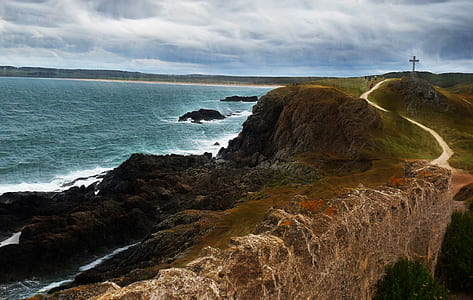 aerial photo of sea water beside cliff thumbnail