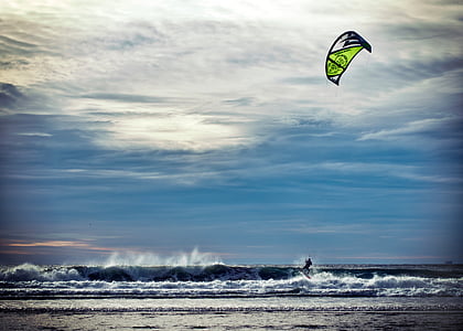 person surfing on ocean waves during daytime thumbnail