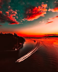 boat, trees and clouds during sunset thumbnail