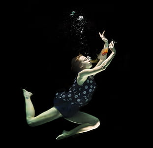 woman drinking wine under water thumbnail