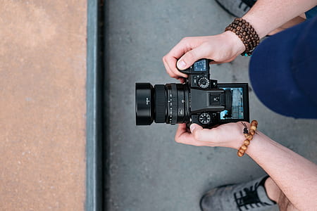 person holding camera thumbnail
