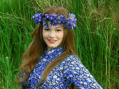 woman wearing blue and white floral print long-sleeved top thumbnail