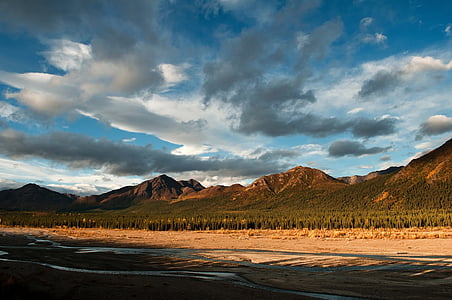 mountain under cloudy sky at daytime thumbnail