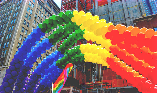 worm's eye view photography of arch of rainbow balloon thumbnail