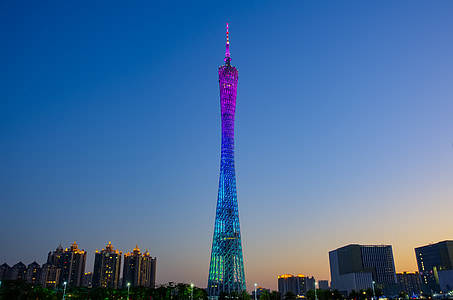 structural photography of purple and blue building under blue sky thumbnail