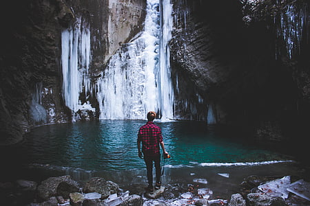 man standing near body of water thumbnail