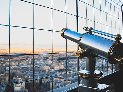 silver and black telescope near window during daytime thumbnail