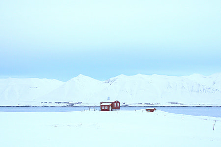red and white house beside body of water thumbnail