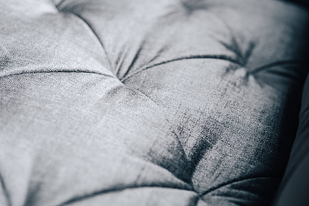 Close-ups of pillows and a grey sofa thumbnail