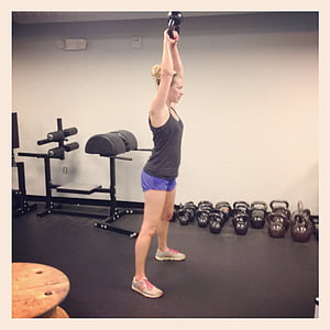 woman lifting a kettle bell thumbnail