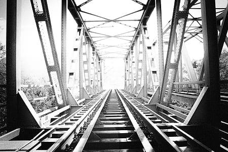 grayscale photo of train rail thumbnail