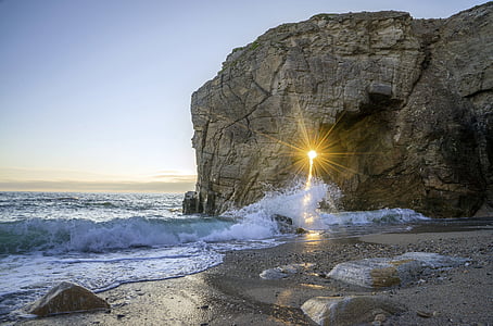 gray rock cliff beside sea thumbnail