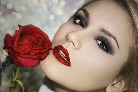 woman's face beside red rose thumbnail