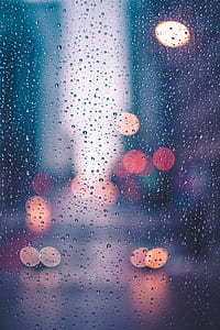 close up photo of glass window with dew drops thumbnail
