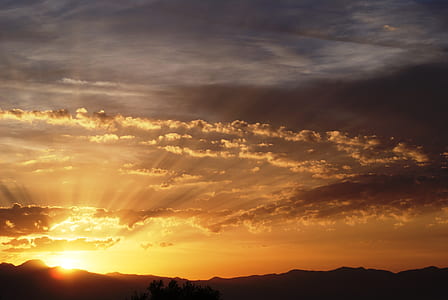 orange and white cloudy skies at sunset thumbnail