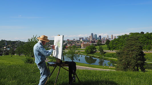 man painting green leaf tree near lake thumbnail