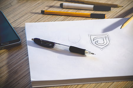 black click pen on white book thumbnail