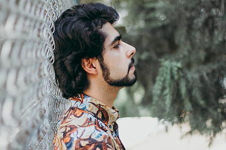 Man Wearing Brown Collar With Buttons Top thumbnail