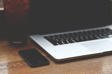 Black Iphone 7 Near Silver Macbook Pro thumbnail