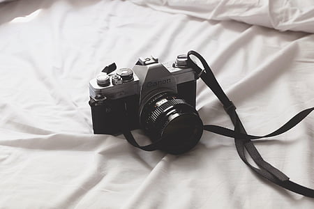 black Canon EOS DSLR camera thumbnail
