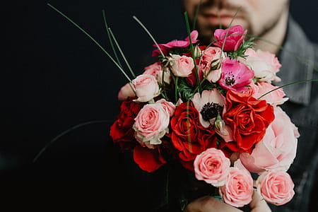 Neatly arranged flowers in a vase thumbnail
