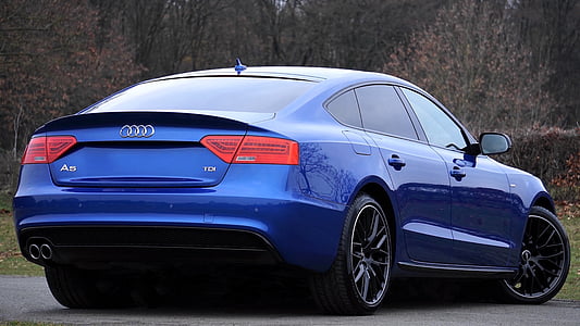 blue Audi A5 sedan parked on concrete ground thumbnail