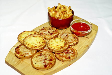 patties and fries with tomato sauce on tray thumbnail