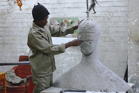man wearing grey shirt doing sculpture thumbnail