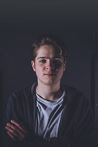 man wearing hoodie and crew-neck shirt thumbnail