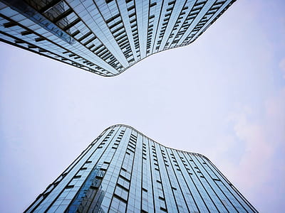 two high rise buildings low angle photography thumbnail