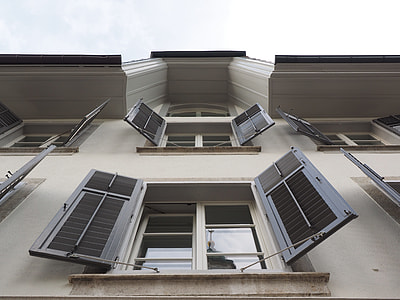 low angle photo of gray wooden window opened thumbnail