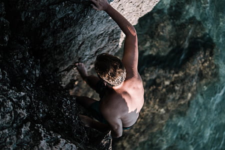 Man Climbing On Cliff thumbnail