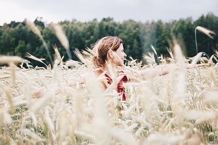 woman standing on rye field thumbnail