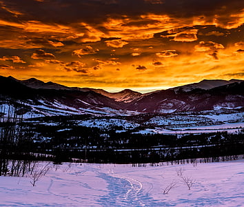 snow covered mountain under cloudy sky thumbnail