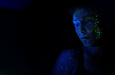 woman with green lights on her face thumbnail
