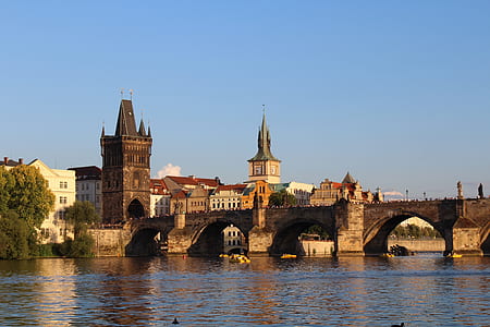 photo of bridge next to building during daytime thumbnail