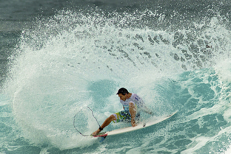 man surfboarding during daytime thumbnail