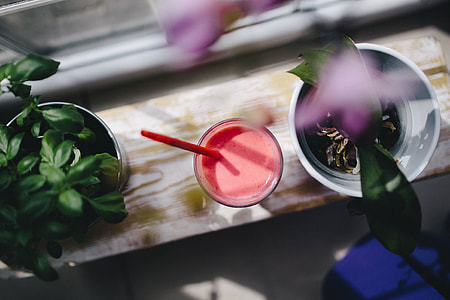 Fresh and healthy fruit milkshake with a straw thumbnail