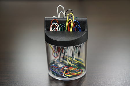 paper clips on clear glass container thumbnail