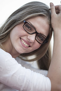 smiling woman wearing black plastic-framed eyeglasses thumbnail