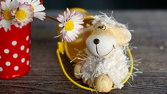 white sheep plush toy beside white daisy flower thumbnail