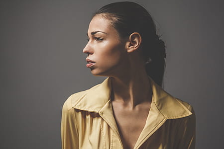 woman standing wearing brown collared shirt thumbnail